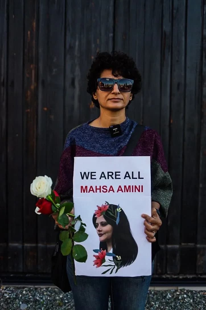 Iranian Woman Holding a Sign